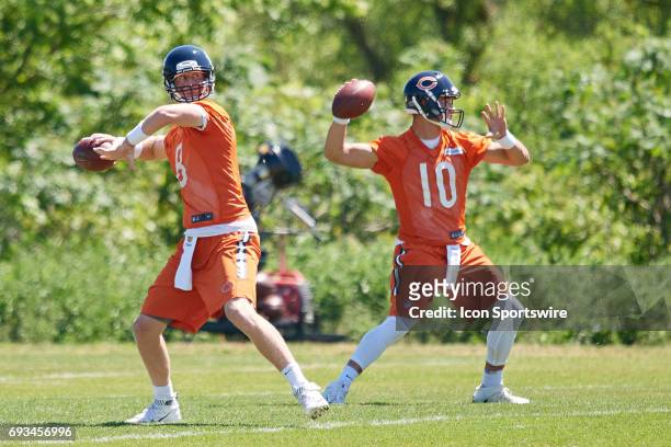 Chicago Bears quarterback Mike Glennon and Chicago Bears quarterback Mitchell Trubisky participate in drills during team OTA workouts on June 06,...
