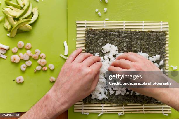 sushi making process - nori stock pictures, royalty-free photos & images