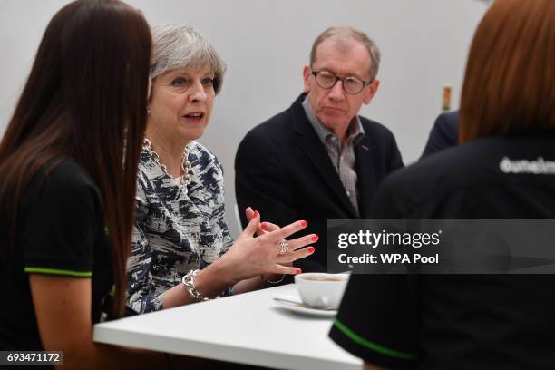 Britain's Prime Minister and leader of the Conservative Party Theresa May and husband Philip speak to staff at a Dunelm department store during a...