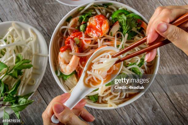 pho, vietnamese soup bowl, with seafood - vietnamese mint stock pictures, royalty-free photos & images