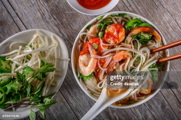 pho, vietnamese soup bowl, with seafood - vietnamese mint stock pictures, royalty-free photos & images