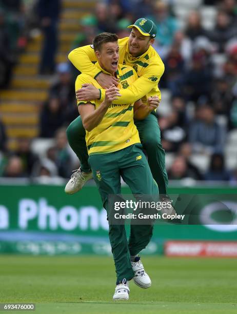 Morne Morkel of South Africa celebrates with David Miller after dismissing Fakhar Zaman of Pakistan during the ICC Champions Trophy match between...