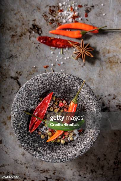 chilli, red pepper flakes and sea salt, pepper, mortar and pestle - spice burst stock pictures, royalty-free photos & images