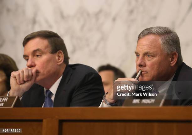 Chairman Richard Burr and ranking member Sen. Mark Warner listen to testimony from Intelligence officials, during a Senate Intelligence Committee...