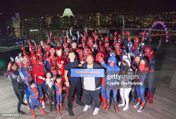 Actors Tom Holland and Jacob Batalon pose with fans during the "Spider-Man: Homecoming" event at Marina Bay Sands on June 6, 2017 in Singapore.