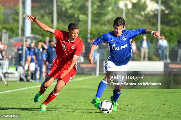 Oliver Batista Meier of Bayern Muenchen and Andriko Smolinski of Schalke 04 compete for the ball during the B Juniors German Championship Semi Final...