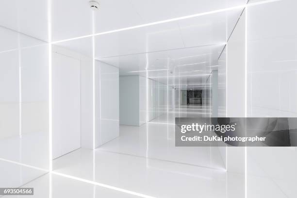 modern office corridor - recessed lighting stock-fotos und bilder