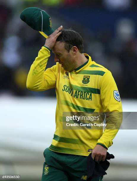 South Africa captain AB de Villiers leaves the field after rain stops play during the ICC Champions Trophy match between Pakistan and South Africa at...