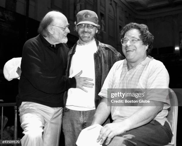 From left, composer/conductor John Williams, director Steven Spielberg and violinist Itzhak Perlman take a break after rehearsing and recording the...