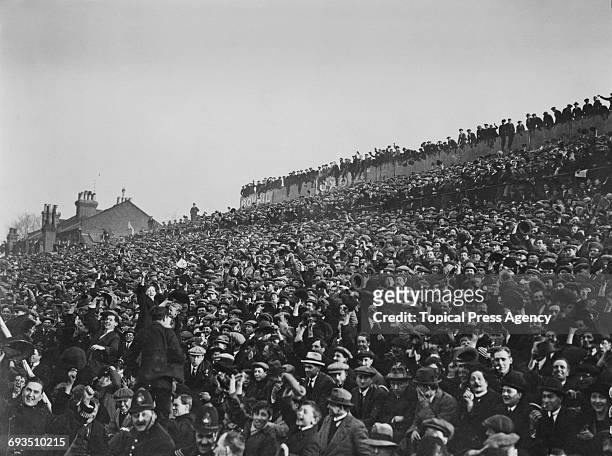 Part of the crowd at Spurs' White Hart Lane ground, London, during Spurs' FA Cup replay against Cardiff City, 9th March 1922. Spurs won the match 2-1.
