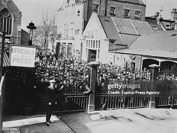 Fans waiting at the gates outside Tottenham Hotspur's White Hart Lane ground, London, before Spurs' FA Cup replay against Cardiff City, 9th March...