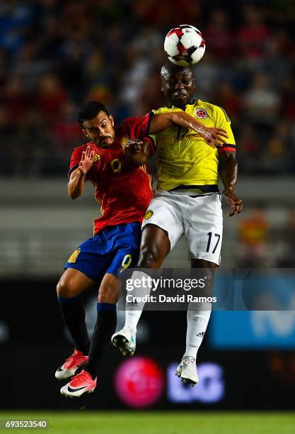 Pedro Rodrguez of Spain and Pablo Armero of Colombia compete for the ball during a friendly match between Spain and Colombia at La Nueva Condomina...