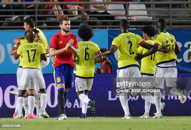 Colombia players celebrate a goal during the friendly international football match Spain vs Colombia at the Condomina stadium in Murcia on June 7,...