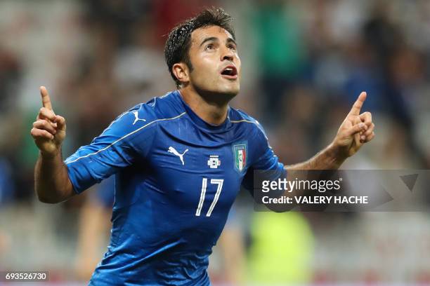 Italy's forward Eder celebrates after scoring a goal during the friendly football match Italy vs Uruguay at the Allianz Riviera Stadium in Nice,...