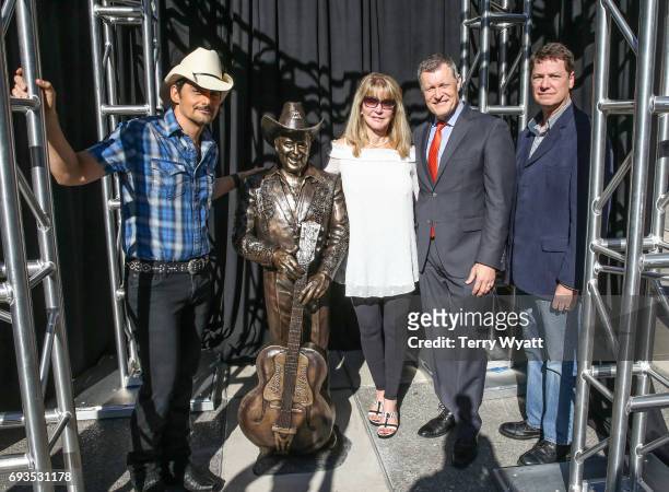 Singer-songwriter Brad Paisley,Mona Dickens,Bill Cody and sculptor Ben Watts attend the unveiling of statues of Little Jimmy Dickens and Bill Monroe...