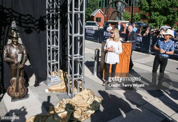 Singer-songwriter Brad Paisley and Mona Dickens attend the unveiling of statues of Little Jimmy Dickens and Bill Monroe at Ryman Auditorium on June...