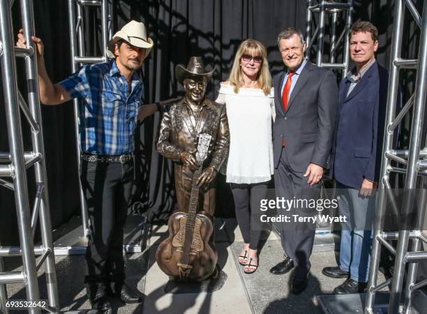 Singer-songwriter Brad Paisley,Mona Dickens,Bill Cody and sculptor Ben Watts attend the unveiling of statues of Little Jimmy Dickens and Bill Monroe...