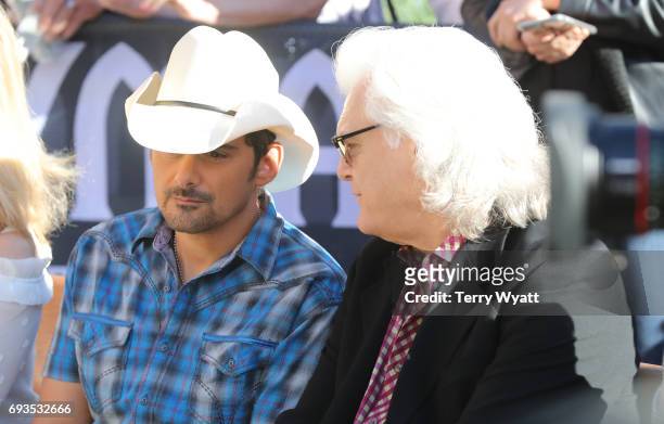 Singer-songwriter Brad Paisley and Ricky Skaggs attend the unveiling of statues of Little Jimmy Dickens and Bill Monroe at Ryman Auditorium on June...