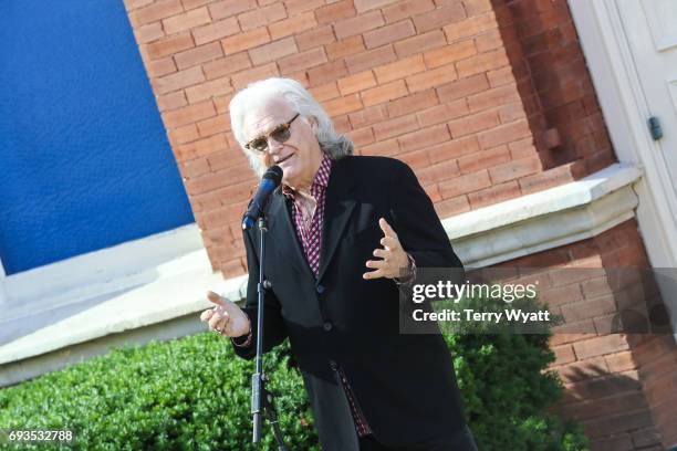 Ricky Skaggs speaks during the unveiling of statues of Little Jimmy Dickens and Bill Monroe at Ryman Auditorium on June 7, 2017 in Nashville,...