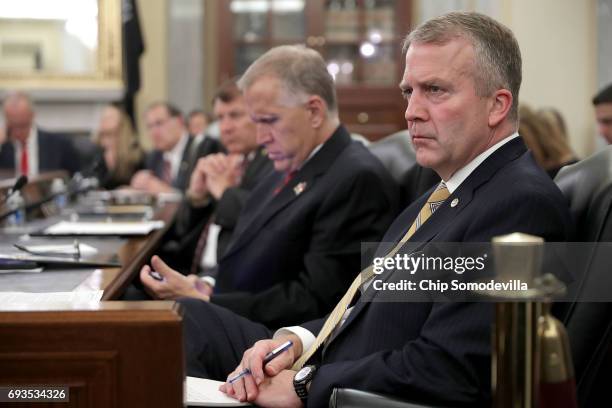 Senate Veterans' Affairs Committe member Sen. Dan Sullivan listens to testimony from U.S. Veterans Affairs Secretary David Shulkin during a hearing...