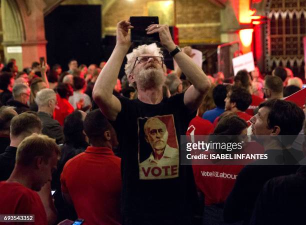 Supporter takes a selfie as Britain's opposition Labour Party leader Jeremy Corbyn delivers his final campaign speech at an election rally at Union...