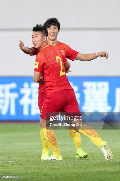 Ren Hang of China celebrates his goal with Hao Junmin of China during the CFA Team China International Football Match between China National Team and...