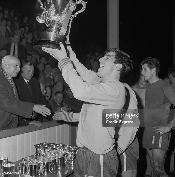 English footballer Terry Venables of Chelsea F.C. Holds aloft the football League Cup after the second leg of the final between Leicester City and...