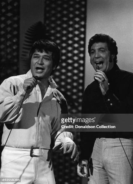 Singers Don Ho and Tom Jones perform on "This Is Tom Jones" TV show in circa 1970 in Los Angeles, California .