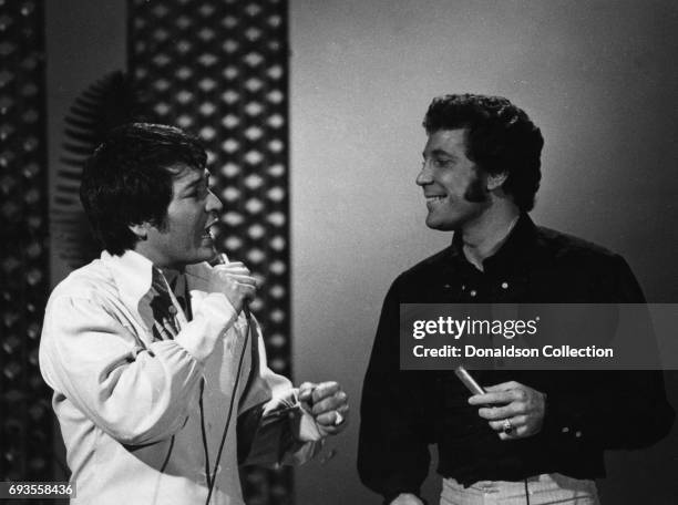 Singers Don Ho and Tom Jones perform on "This Is Tom Jones" TV show in circa 1970 in Los Angeles, California .