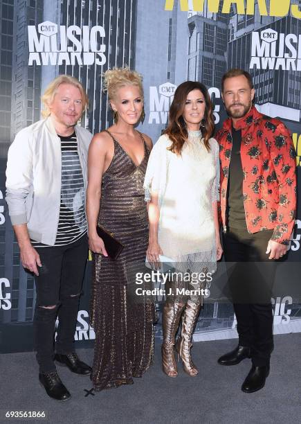 Musicians Phillip Sweet, Kimberly Schlapman, Karen Fairchild and Jimi Westbrook of Little Big Town attends the 2017 CMT Music Awards at the Music...
