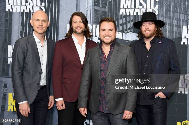 Musicians Jon Jones, Chris Thompson, Mike Eli, and James Young of Eli Young band attend the 2017 CMT Music Awards at the Music City Center on June 7,...