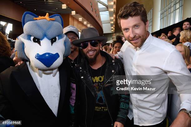The Nashville Predators mascot Gnash, Preston Brust of Locash, and Brett Eldredge attend the 2017 CMT Music Awards at the Music City Center on June...