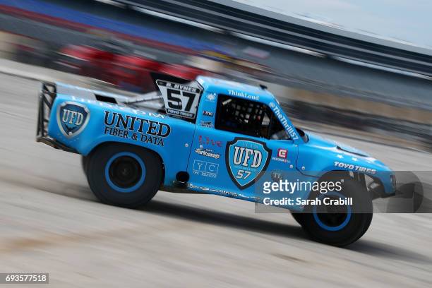 Drew Davison of Star-Telegram participates in Speed Energy Super Trucks ride-alongs with former NASCAR/INDYCAR star Robby Gordon at Texas Motor...