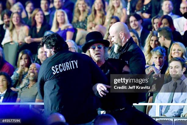 Big Kenny of Big & Rich carried off stage durring the 2017 CMT Music Awards at the Music City Center on June 7, 2017 in Nashville, Tennessee.