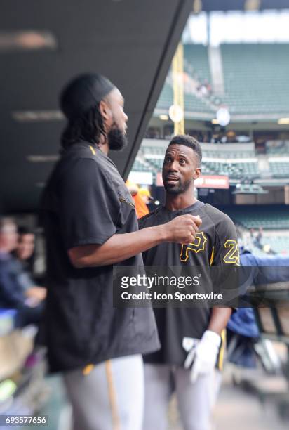 Pittsburgh Pirates center fielder Andrew McCutchen talks with first baseman Josh Bell in the dugout during an MLB game between the Pittsburgh Pirates...