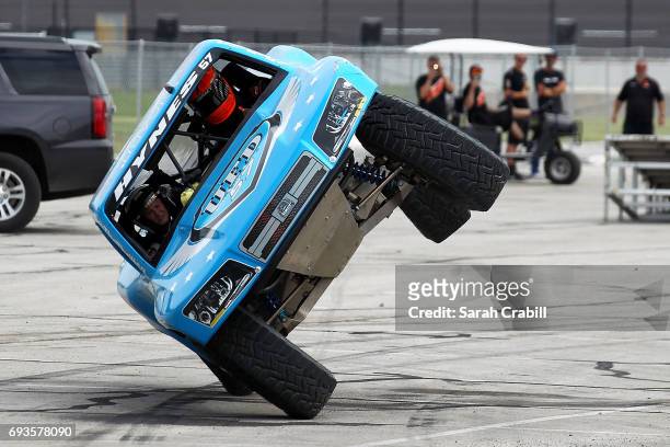 Members of the media participate in Speed Energy Super Trucks ride-alongs with former NASCAR/INDYCAR star Robby Gordon at Texas Motor Speedway on...