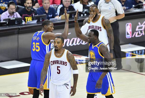 Kevin Durant and Draymond Green of the Golden State Warriors celebrate after a play in the first quarter against the Cleveland Cavaliers in Game 3 of...