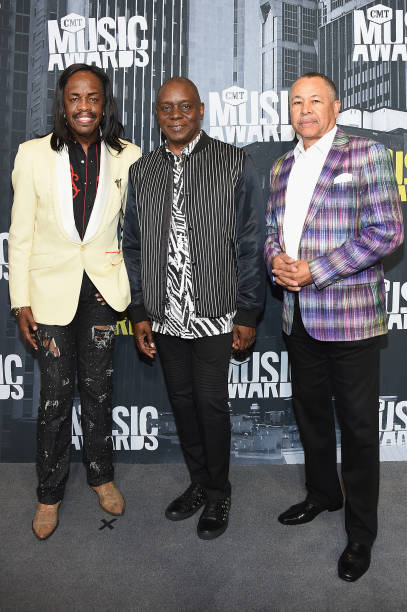 Musicians Verdine White, Philip Bailey Jr, Ralph Johnson of musical group Earth, Wind & Fire attend the 2017 CMT Music Awards at the Music City...