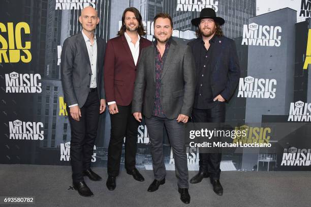 Musicians Jon Jones, Chris Thompson, Mike Eli, and James Young of Eli Young Band attend the 2017 CMT Music Awards at the Music City Center on June 7,...