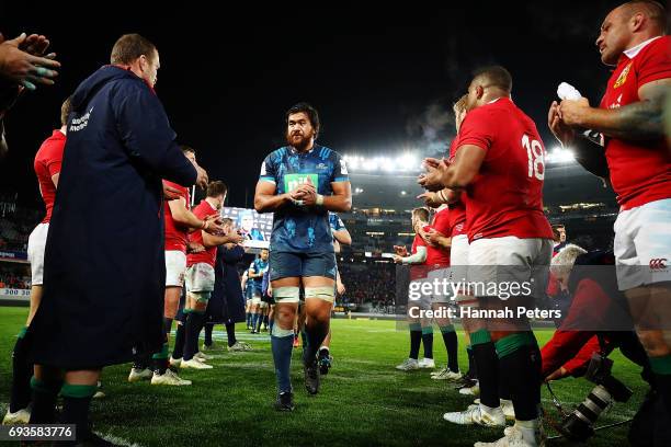 Steven Luatua of the Blues is congratulated by the Lions team after winning the match between the Auckland Blues and the British & Irish Lions at...