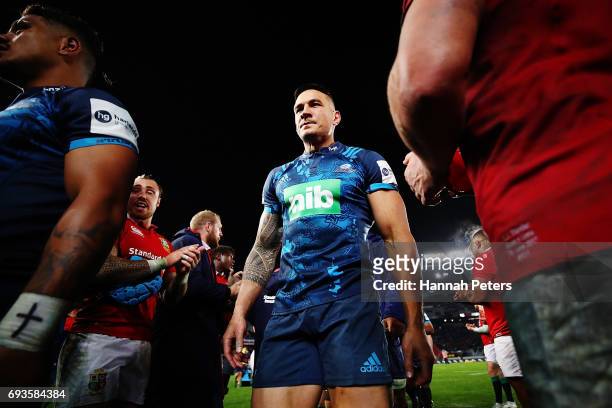 Sonny Bill Williams of the Blues is congratulated by the Lions team after winning the match between the Auckland Blues and the British & Irish Lions...