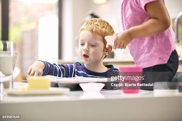 children baking cupcakes - bjarte rettedal stock pictures, royalty-free photos & images