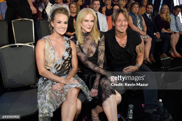 Carrie Underwood, Nicole Kidman and Keith Urban in the audience during the 2017 CMT Music Awards at the Music City Center on June 7, 2017 in...