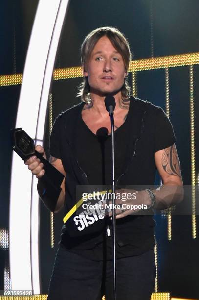 Keith Urban accepts Best Male Video of the Year award onstage during the 2017 CMT Music Awards at the Music City Center on June 6, 2017 in Nashville,...