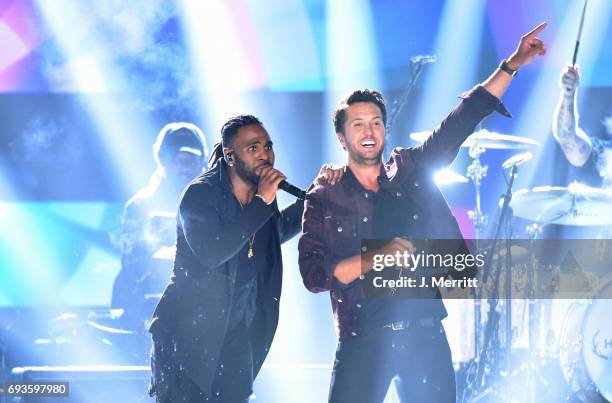 Jason Derulo and Luke Bryan perform onstage during the 2017 CMT Music Awards at the Music City Center on June 7, 2017 in Nashville, Tennessee.