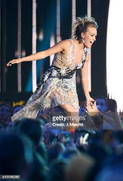 Carrie Underwood accepts the Female Video of the Year Award during the 2017 CMT Music Awards at the Music City Center on June 7, 2017 in Nashville,...