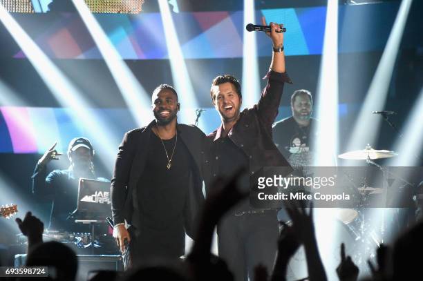 Jason Derulo and Luke Bryan perform onstage during the 2017 CMT Music awards at the Music City Center on June 7, 2017 in Nashville, Tennessee.