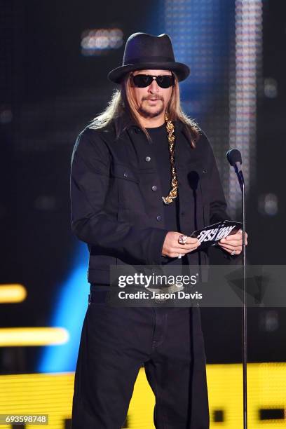 Kid Rock presents an award onstage during the 2017 CMT Music Awards at the Music City Center on June 7, 2017 in Nashville, Tennessee.