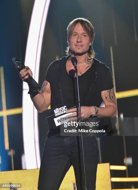 Keith Urban accepts an award onstage during the 2017 CMT Music Awards at the Music City Center on June 6, 2017 in Nashville, Tennessee.