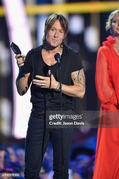 Keith Urban accepts an award onstage at the 2017 CMT Music Awards at the Music City Center on June 7, 2017 in Nashville, Tennessee.